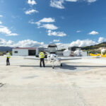 Image of pilot doing a pre-flight inspection.