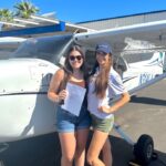 CFI awarding Leopard Aviation student with her commercial pilot certificate.