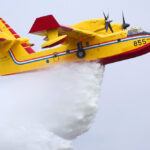 picture of plane dropping water on fire